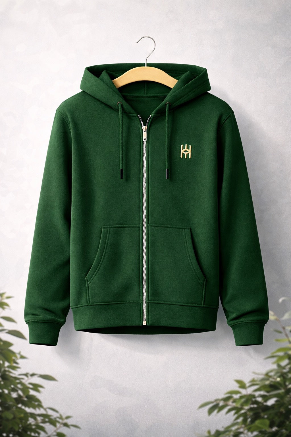 A zip-up hoodie made from soft, comfortable fabric. It has a full-length front zipper, a hood with drawstrings, and long sleeves. The fit is relaxed and casual, suitable for layering over t-shirts or under jackets.
